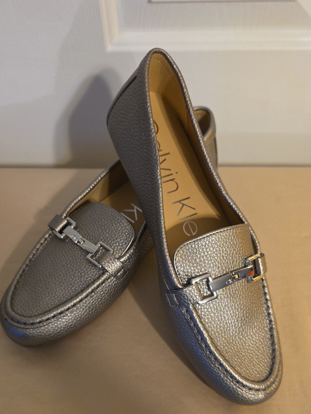Calvin Klein Women's Metallic Silver Loafers with Brushed Hardware